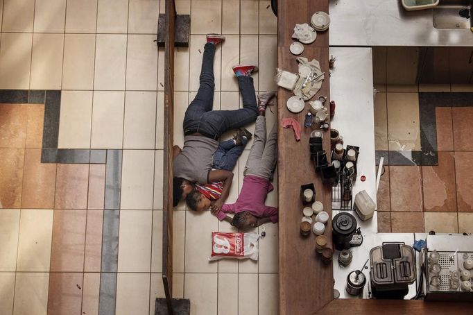 Tyler Hicks, a U.S. photographer working for The New York Times won the 2nd Prize in the Spot News Stories category of the 2014 World Press Photo contest with his series of pictures which include this one of a woman and children hiding in the Westgate mall in Nairobi, Kenya, September 21, 2013. They escaped unharmed after gunmen had opened fire at the upscale Nairobi mall. The prize-winning entries of the World Press Photo Contest 2014, the world's largest annual press photography contest, were announced February 14, 2014.