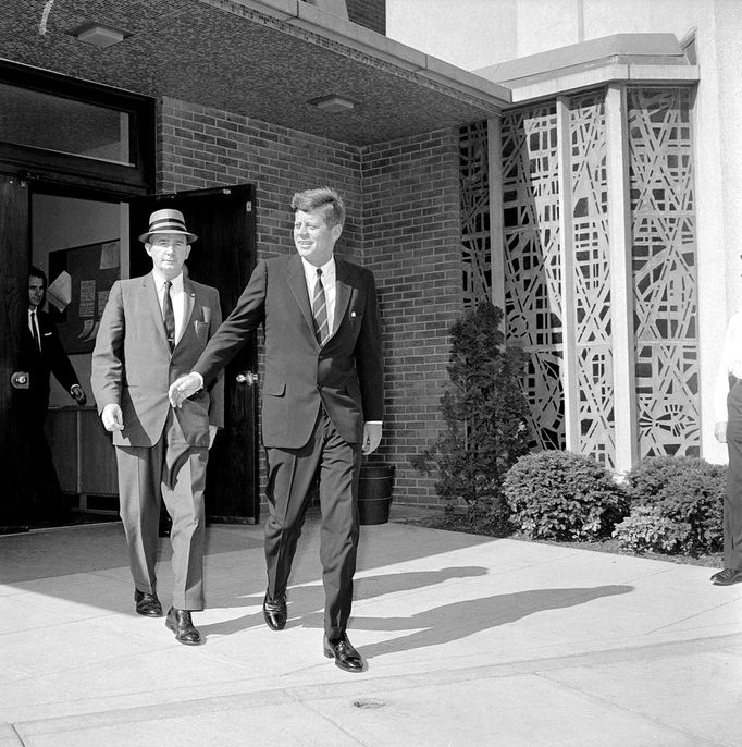 ohn Kennedy and White House Receptionist President John Kennedy and the White House receptionist David Powers leave St. Stephen's Roman Catholic Church in Washington, DC.