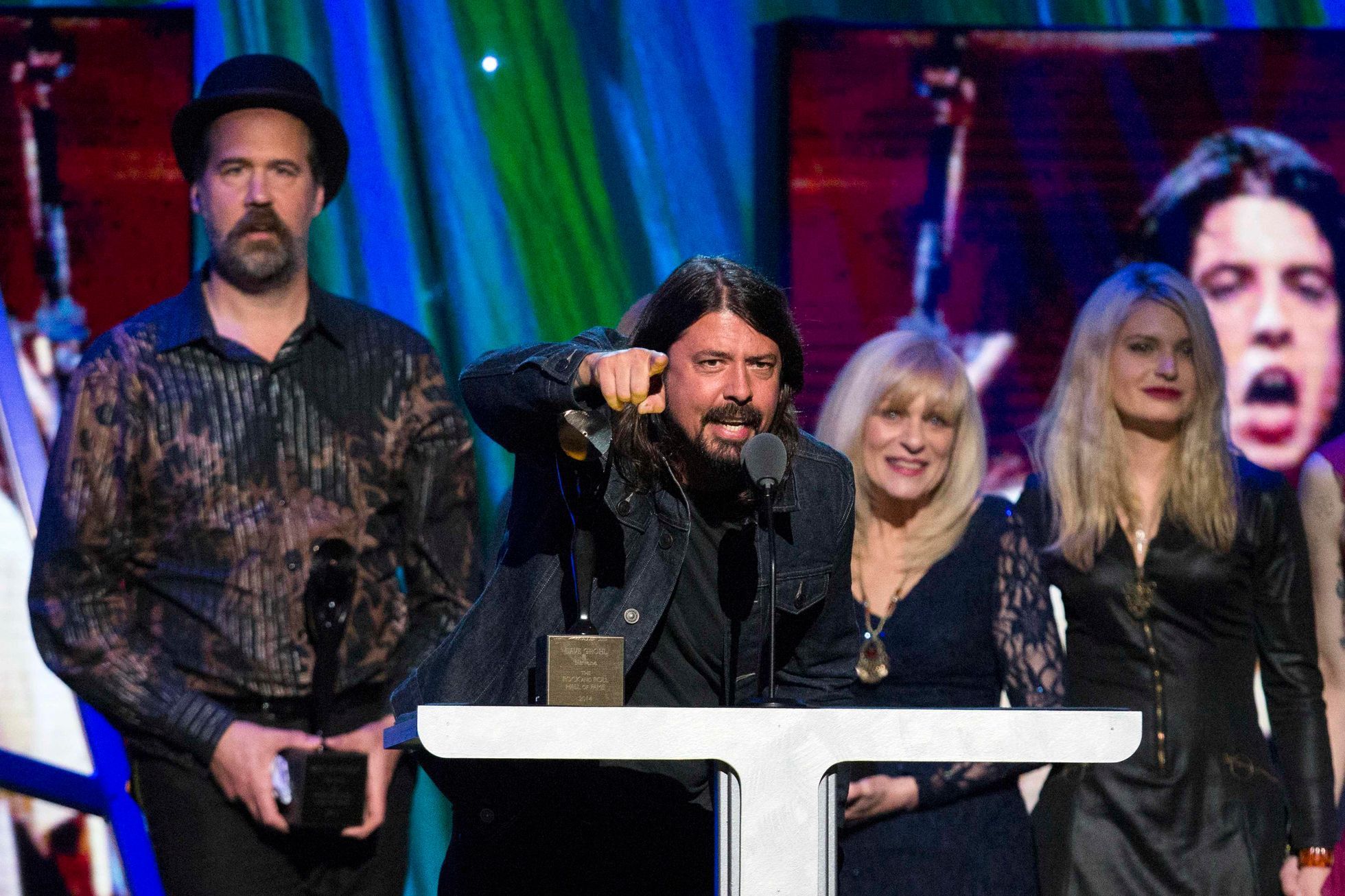 Drummer Grohl of Nirvana speaks in front of Novoselic after band was inducted during 29th annual Rock and Roll Hall of Fame Induction Ceremony in Brooklyn, New York