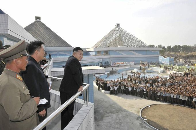 North Korean leader Kim Jong-Un (foreground, on R) inspects the construction site of the Munsu Swimming Complex, which is nearing completion, in this undated photo releas