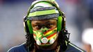 Seattle Seahawks running back Marshawn Lynch wears a mask during warm-ups befire the start of the NFL Super Bowl XLIX football game against the New England Patriots in Gl