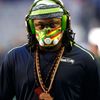 Seattle Seahawks running back Marshawn Lynch wears a mask during warm-ups befire the start of the NFL Super Bowl XLIX football game against the New England Patriots in Glendale