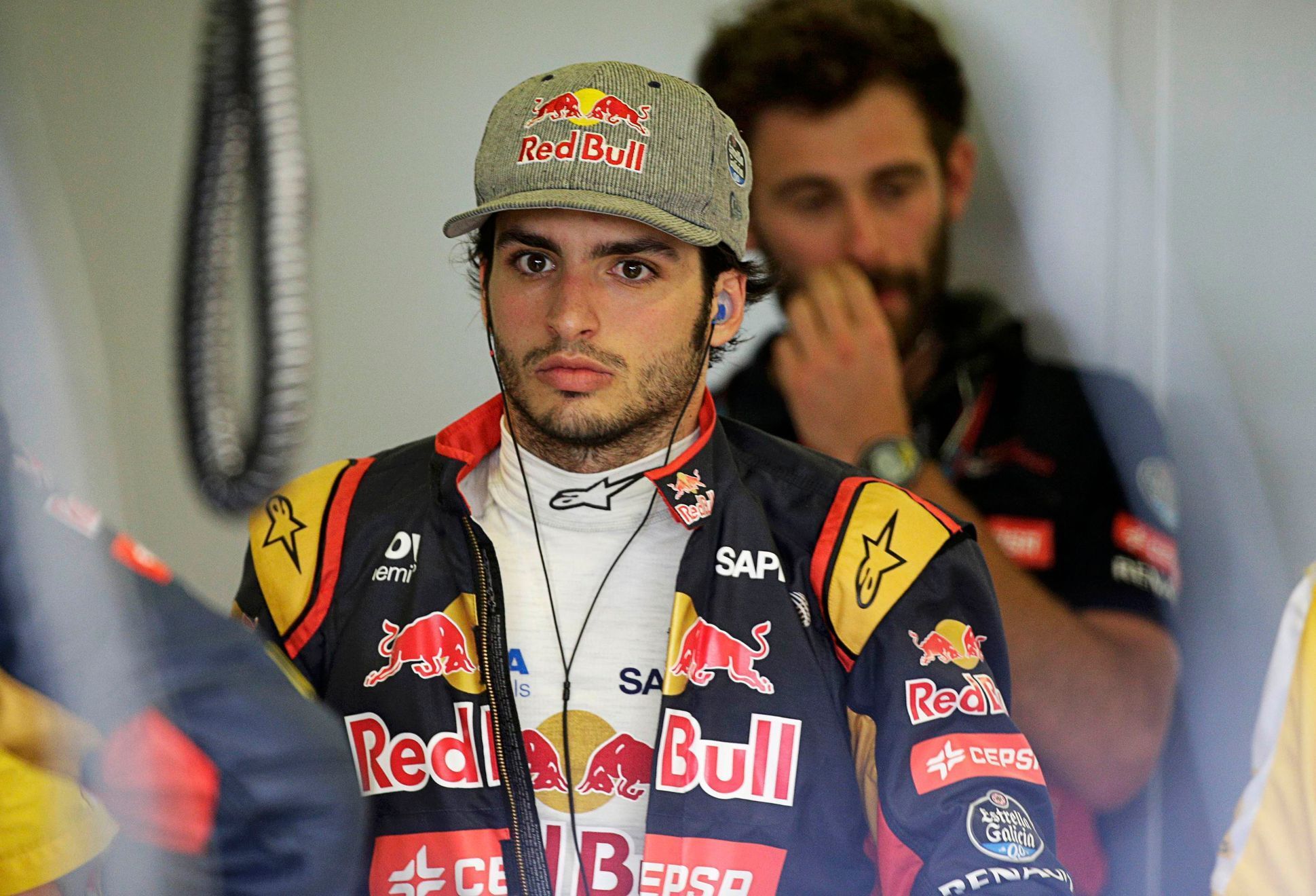 Toro Rosso Formula One driver Carlos Sainz of Spain walks in the team garage during the third practice session of the Australian F1 Grand Prix at the Albert Park circuit in Melbourne
