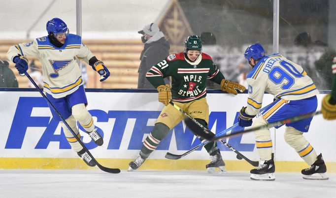 Brandon Duhaime (21) battles for the puck with St. Louis Blues center Ryan O'Reilly (90) and defenseman Marco Scandella (6)