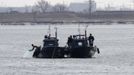 North Korean military personnel are seen on patrol boats on Yalu River near the North Korean town of Sinuiju, opposite the Chinese border city of Dandong, March 29, 2013. China called for an easing of tensions on Friday as North Korea put its missile units on standby to attack U.S. military bases in South Korea and the Pacific after the United States flew two nuclear-capable stealth bombers over the Korean peninsula. REUTERS/Jacky Chen