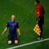 Robben of the Netherlands celebrates next to first assistant referee Faverani after scoring a goal during their 2014 World Cup Group B match against Spain at the Fonte Nova arena in Salvador