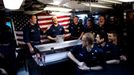 April 24, 2011 - Cape Canaveral, Florida, U.S. - -- Cape Canaveral, Fla. -- Culinary Specialist Seaman Tyler Keyes, middle, of Stillwater, Minnesota, shown with Commander John Gearhart, left, and Commander Master Chief Andy Smith, right, is congratulated after receiving his Submarine qualification pins during a Dolphin presentation in the Crew's Mess aboard the USS Annapolis (SSN 760), a S6G nuclear reactor powered fast attack submarine, sailing from Cape Canaveral on Sunday. The pins were first authorized for use in 1941. To ''Qualify Submarines,'' a submariner must possess an in-depth knowledge of ship's construction, operation, and damage control and demonstrate his reliability under battle conditions. The USS Annapolis measures 362 ft. in length and 33 ft. at the beam, a diving depth of over 400 ft., 27+ mph, 12 vertical launch missile tubes, 4 torpedo tubes ( automatický překlad do češtiny )