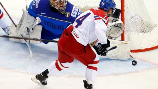 Italy's goalie Daniel Belissimo (L) saves in front of Jiri Hudler of the Czech Republic (R) during the first period of their men's ice hockey World Championship Group A g