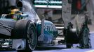 Mercedes Formula One driver Lewis Hamilton of Britain enters the pit with a puncture during the British Grand Prix at the Silverstone race circuit, central England, June