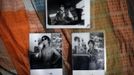 Old photographs of Xiao Cao, a 57-year-old gay man, are on display at his home in Shanghai April 22, 2012. China's gay community has long been on the edges of society but it is gradually becoming more accepted. Cao, who is an unemployed drag queen, is one whose life lifts the curtain on a less romanticised view of Chinese homosexuals. Living in an eight-square-metre apartment behind a public toilet and with a monthly income of 500 yuan ($79) from social insurance, he passes his days dancing in public and spending time with friends at gay clubs. Picture taken April 22, 2012. REUTERS/Aly Song (CHINA - Tags: SOCIETY) CHINA OUT. NO COMMERCIAL OR EDITORIAL SALES IN CHINA. ATTENTION EDITORS PICTURE 07 OF 28 OF PACKAGE 'GAY AND OUT IN CHINA' TO FIND ALL IMAGES SEARCH 'GAY OUT CHINA' Published: Čer. 1, 2012, 12:35 dop.