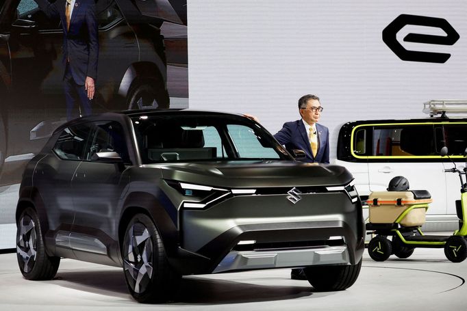 President and Representative Director at Suzuki Motor Corporation Toshihiro Suzuki unveils the Suzuki eVX at a press day of the Japan Mobility Show 2023 at Tokyo Big Sigh