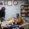 Pastor Lee Jong-rak feeds his 25-year-old son Lee Eun-man, who has cerebral palsy, at the Joosarang church in Seoul September 18, 2012. The South Korean pastor, who runs a "baby box" where mothers can leave unwanted infants, has seen a sharp increase in the number of newborns being left there because, the pastor says, of a new law aimed protecting the rights of children. South Korea is trying to shed a reputation of being a source of babies for adoption by people abroad. It is encouraging domestic adoption and tightening up the process of a child's transfer from birth mother to adoptive parents. Picture taken September 18, 2012. REUTERS/Kim Hong-Ji (SOUTH KOREA - Tags: SOCIETY) Published: Říj. 7, 2012, 6:52 dop.