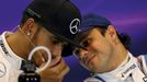 Mercedes Formula One driver Lewis Hamilton of Britain (L) speaks with Williams driver Felipe Massa of Brazil during a news conference following the qualifying session of