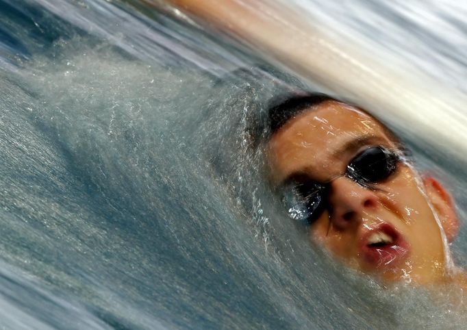 Hungarian swimmer Laszlo Cseh swims during a training session in Budapest April 12, 2012. As Hungarian swimmer Laszlo Cseh trains in four-hour, early-morning sessions, his mind is on the man who could once again spoil his Olympic dream: Michael Phelps. Cseh won his only world championship gold in an event Phelps decided to skip in 2005. When Phelps skipped more events, another American, Ryan Lochte was there to claim the crown, leaving Cseh in second or third place again. Picture taken April 12, 2012. To match Feature OLYMPICS-SWIMMING/CSEH REUTERS/Laszlo Balogh (HUNGARY - Tags: SPORT OLYMPICS SWIMMING)