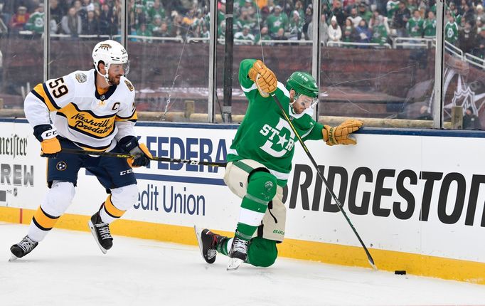 Jan 1, 2020; Dallas, TX, USA; Dallas Stars center Jason Dickinson (18) chases the puck against Nashville Predators defenseman Roman Josi (59) during the third period in t