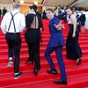 Director Xavier Dolan and cast members of the film &quot;Mommy&quot;, pose on the red carpet as they arrive at the closing ceremony of the 67th Cannes Film Festival