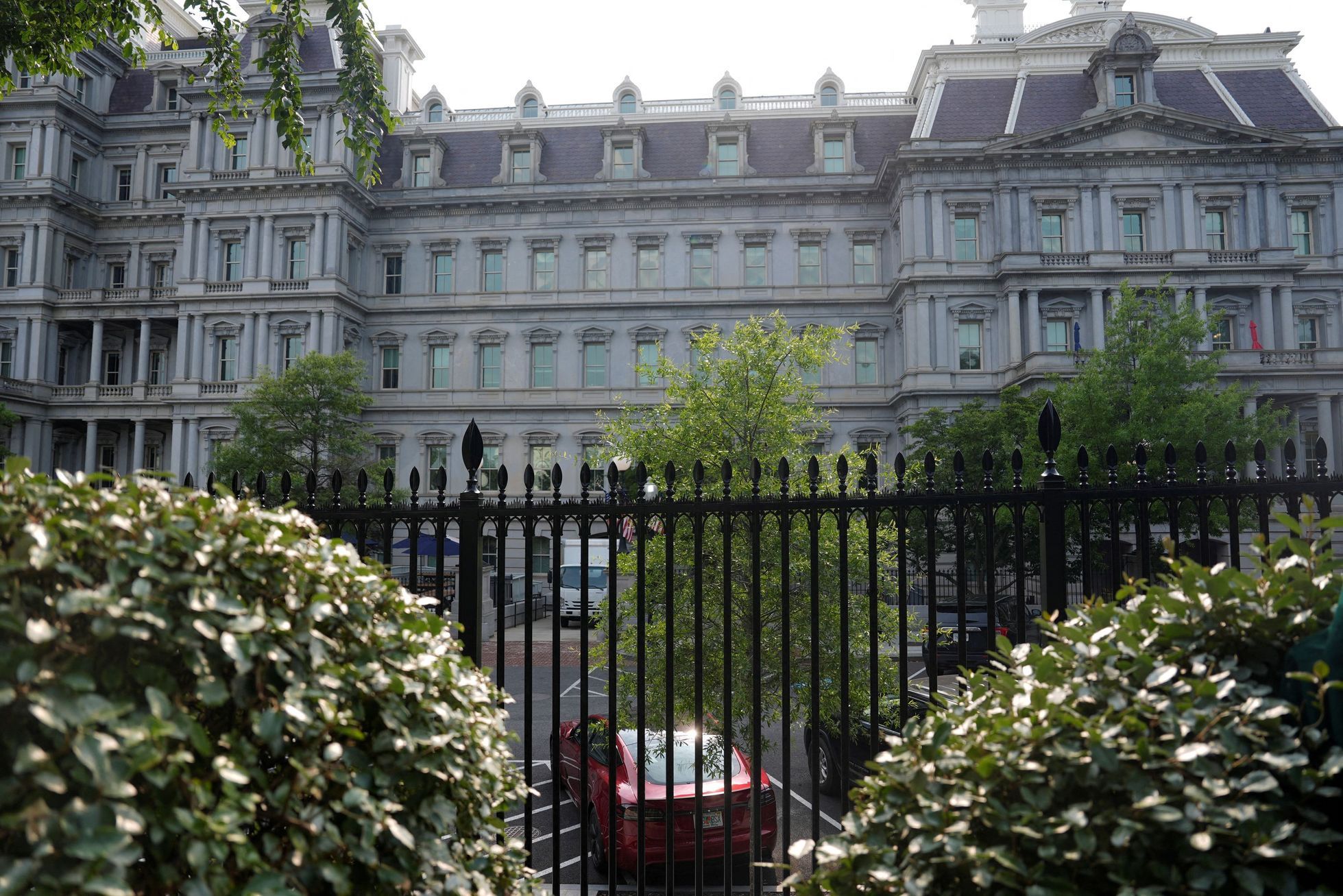 A Tesla vehicle is parked in West Executive Avenue, near the White House, in Washington