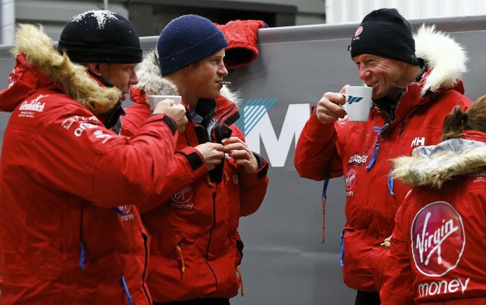 Britain's Prince Harry eats a biscuit after a cold chamber training exercise with the Walking with the Wounded South Pole Allied Challenge 2013 British team at Nuneaton in central England