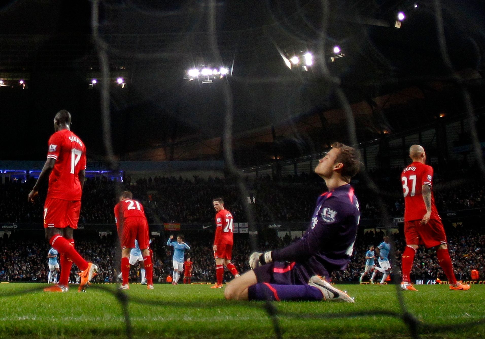 Liverpool's goalkeeper Mignolet reacts after Manchester City's Negredo scores a goal  during their English Premier League soccer match at the Etihad stadium in Manchester