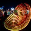 Concert-goer uses illuminated hula hoop during performance by Canadian electrofunk duo Chromeo at Coachella Valley Music and Arts Festival in Indio, California