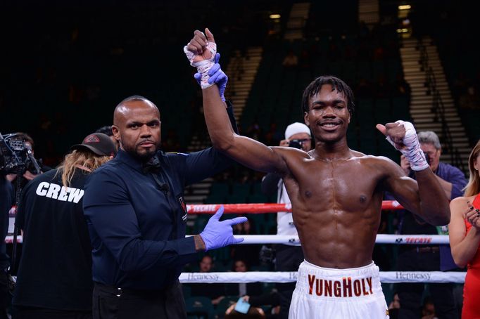 Nov 2, 2019; Las Vegas, NV, USA; Evan Holyfield (white trunks) celebrates after defeating Nick Winstead (not pictured) in their super welterweight bout at MGM Grand Garde