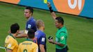 Australia's Matthew Spiranovic (R) lies on the pitch after being fouled by Robin van Persie (top L) of the Netherlands, who is shown the yellow card by referee Djamel Hai