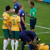 Australia's Spiranovic lies on the pitch after being fouled by van Persie of the Netherlands during their 2014 World Cup Group B soccer match in Porto Alegre