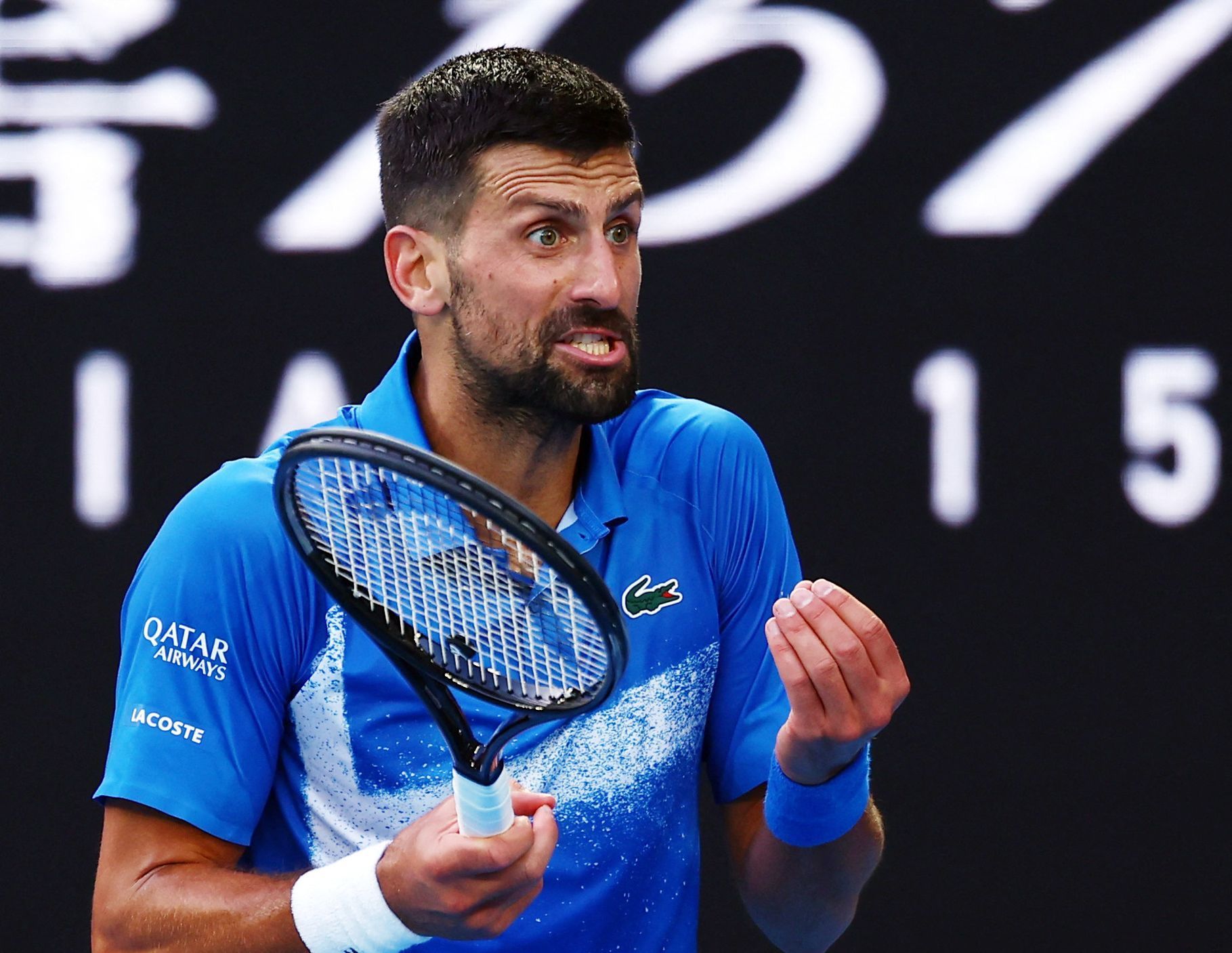Novak Djokovič v zápase 3. kola Australian Open s Tomášem Macháčem