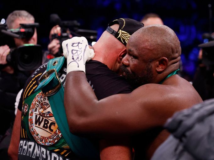 Boxing - WBC World Heavyweight Title - Tyson Fury v Derek Chisora - Tottenham Hotspur Stadium, London, Britain - December 3, 2022  Tyson Fury and  Derek Chisora after the