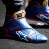 The racing boots of Toro Rosso Formula One driver Max Verstappen of the Netherlands is seen during a photo session before the Australia Formula One Grand Prix, at Melbourne's Albert Park Track