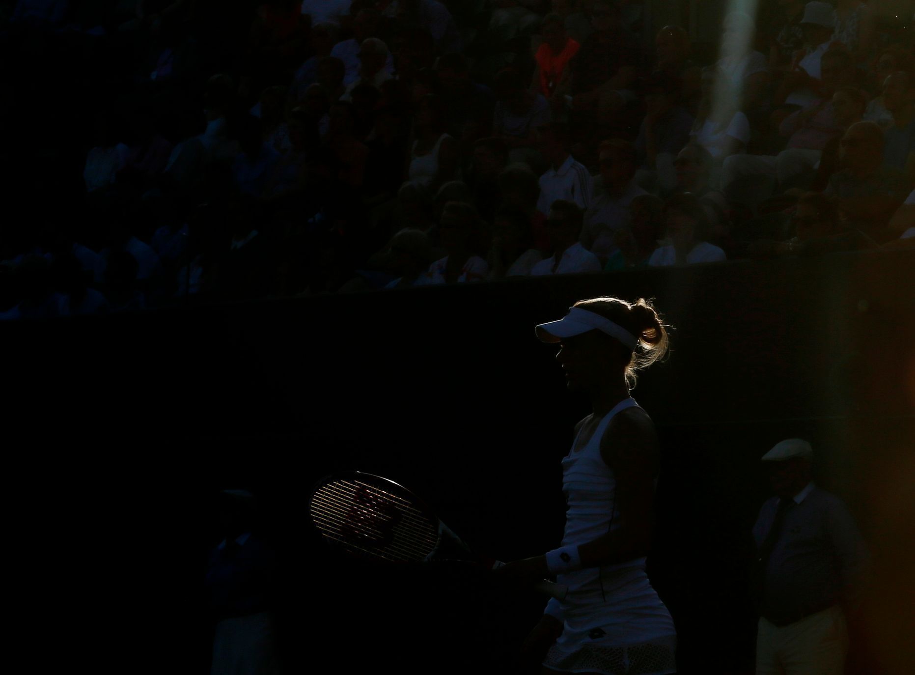 Afternoon sunlight shines on Lucie Safarova of the Czech Republic during her match against Alison Riske of the U.S.A. at the Wimbledon Tennis Championships in London
