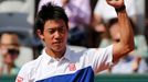 Kei Nishikori of Japan celebrates after defeating Paul-Henri Mathieu of France during their men's singles match at the French Open tennis tournament at the Roland Garros