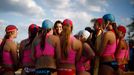 Catherine, Britain's Duchess of Cambridge, meets with young surf lifesavers during her visit to a surf lifesaving demonstration at Sydney's Manly Beach