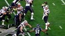 Feb 1, 2015; Glendale, AZ, USA; New England Patriots quarterback Tom Brady (12) throws a pass during the first quarter against the Seattle Seahawks in Super Bowl XLIX at