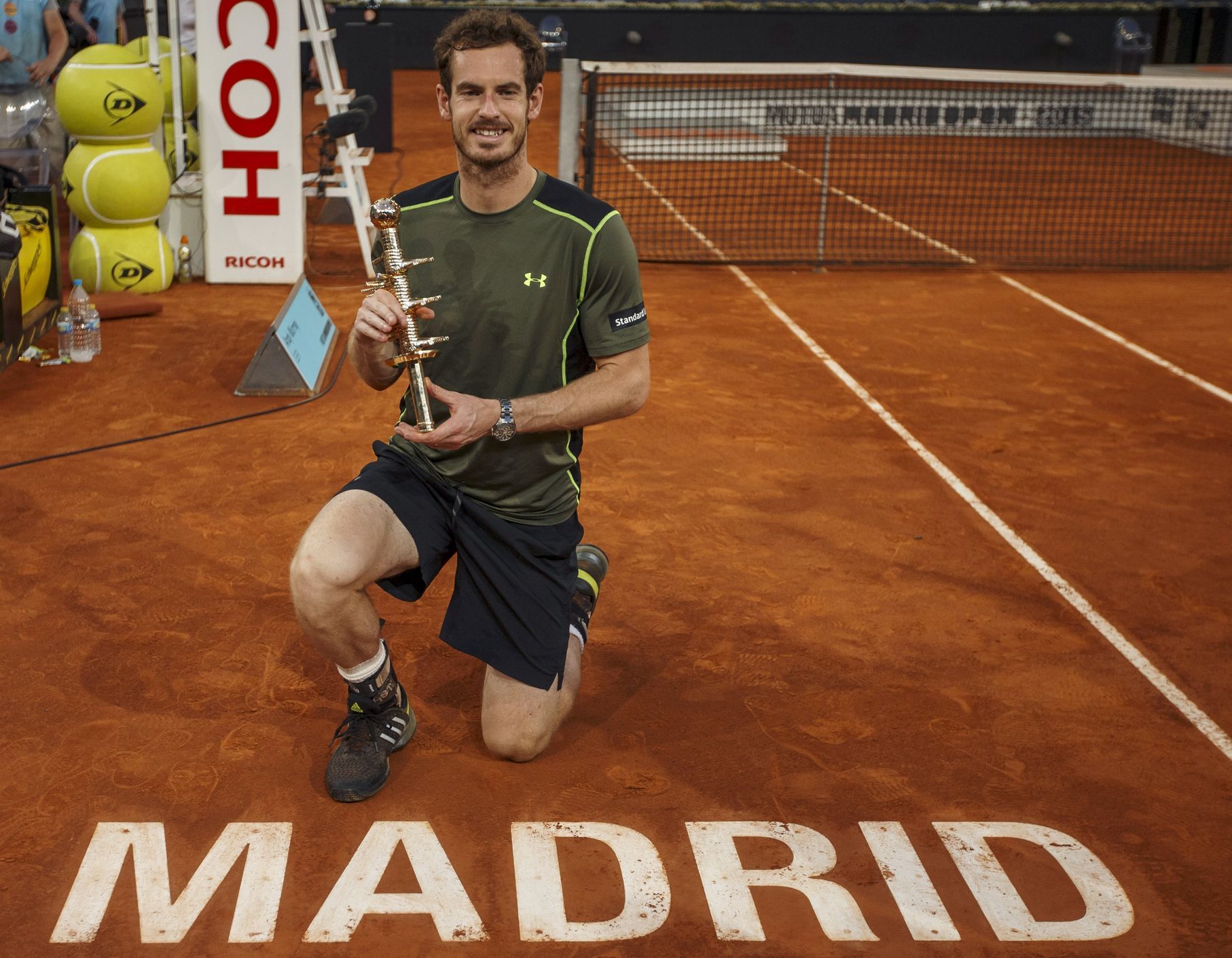 Britain's Murray poses with his trophy after winning the final match over Spain's Nadal at the Madrid Open tennis tournament in Madrid