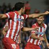 Atletico Madrid's Costa celebrates his penalty goal against Chelsea with team mate Suarez during their Champions League semi-final second leg soccer match at Stamford Bridge stadium in London