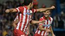 Atletico Madrid's Diego Costa celebrates his penalty goal against Chelsea with team mate Mario Suarez (R) during their Champions League semi-final second leg soccer match