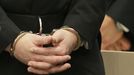 The hands of Anders Behring Breivik are seen in handcuffs as he arrives in the courtroom, in Oslo, Norway Friday, Aug. 24, 2012. Anders Behring Breivik was convicted Friday of terrorism and premeditated murder for bomb and gun attacks that killed 77 people and sentenced to a special prison term that would allow authorities to keep him locked up for as long as he is considered dangerous. (AP Photo/Frank Augstein)