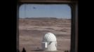 The Musk Observatory is seen from the working and living quarters at the Mars Desert Research Station (MDRS) outside Hanksville in the Utah desert March 2, 2013. The MDRS aims to investigate the feasibility of a human exploration of Mars and uses the Utah desert's Mars-like terrain to simulate working conditions on the red planet. Scientists, students and enthusiasts work together developing field tactics and studying the terrain. All outdoor exploration is done wearing simulated spacesuits and carrying air supply packs and crews live together in a small communication base with limited amounts of electricity, food, oxygen and water. Everything needed to survive must be produced, fixed and replaced on site. Picture taken March 2, 2013. REUTERS/Jim Urquhart (UNITED STATES - Tags: SCIENCE TECHNOLOGY SOCIETY ENVIRONMENT) ATTENTION EDITORS: PICTURE 26 OF 31 FOR PACKAGE 'MARS IN THE DESERT' SEARCH 'JIM MARS' FOR ALL IMAGES Published: Bře. 11, 2013, 2:07 odp.