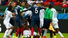 Wilson Palacios of Honduras lies on the pitch during a scuffle with the French players during their 2014 World Cup Group E soccer match at the Beira Rio stadium in Porto