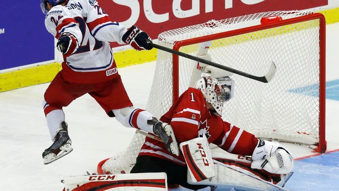 Czech Republic's Simon scores the game winning goal on Canada's goalie Paterson during a shootout in their IIHF World Junior Championship ice hockey game in Malmo