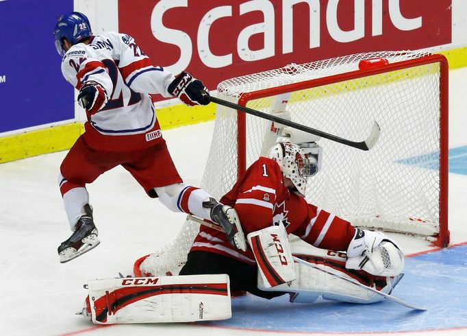 Czech Republic's Simon scores the game winning goal on Canada's goalie Paterson during a shootout in their IIHF World Junior Championship ice hockey game in Malmo