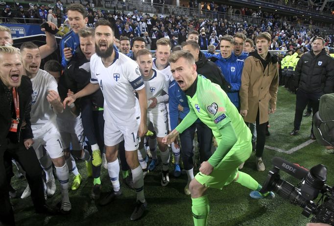 Soccer Football - Euro 2020 - Group J Qualification - Finland v Liechtenstein - Helsinki, Finland November 15, 2019. Captain Tim Sparv and goalkeeper Lukas Hradecky of Fi