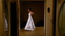 A dancer waits before the opening ceremony of the Opera Ball in Vienna