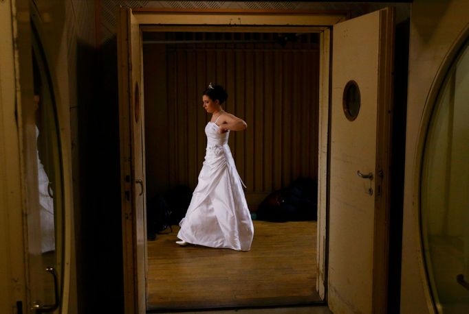 A dancer waits before the opening ceremony of the Opera Ball in Vienna