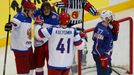 Russia's Yevgeni Malkin (C) celebrates his goal with team mates Viktor Tikhonov and Nikolai Kulyomin as France's Baptiste Amar (R) reacts during the second period of thei