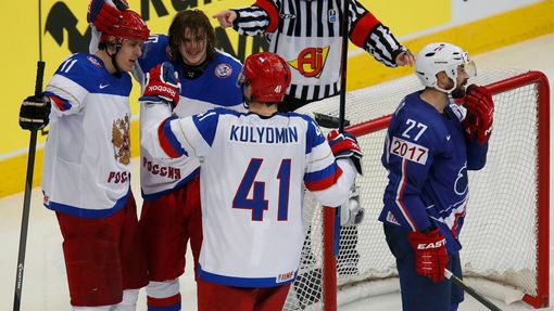 Russia's Yevgeni Malkin (C) celebrates his goal with team mates Viktor Tikhonov and Nikolai Kulyomin as France's Baptiste Amar (R) reacts during the second period of thei