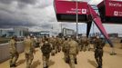 Members of the armed forces take a tour of the Olympic Park in Stratford, the location of the London 2012 Olympic Games, in east London July 15, 2012. London's Olympic Games is not threatened by a major security contractor's failure to find enough staff, ministers and the head of the city's organising committee said on Sunday, seeking to quell a political storm ahead of athletes' arrival. REUTERS/Andrew Winning (BRITAIN - Tags: SPORT OLYMPICS MILITARY POLITICS) Published: Čec. 15, 2012, 4:05 odp.