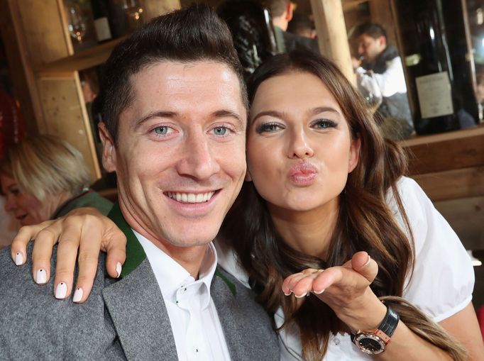 FC Bayern Munich's Lewandowski and his wife Anna pose during their visit at the Oktoberfest in Munich