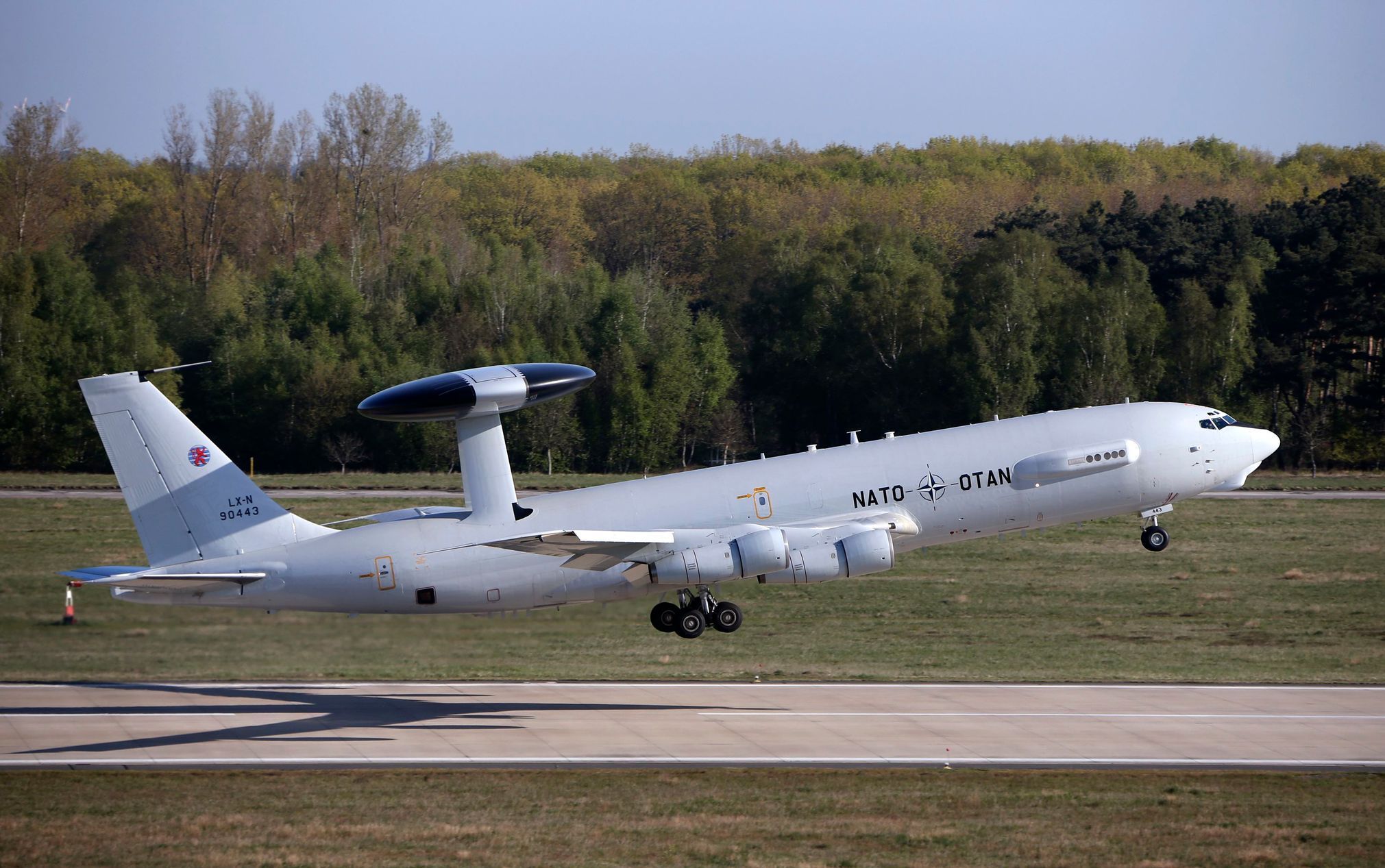 A NATO Airborne Warning and Control Systems aircraft takes-off for flight to Romania from the AWACS air base in Geilenkirchen, near the German-Dutch border